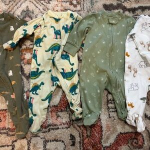 Bundle of 4 footie pajamas. 2 old navy 2 carters